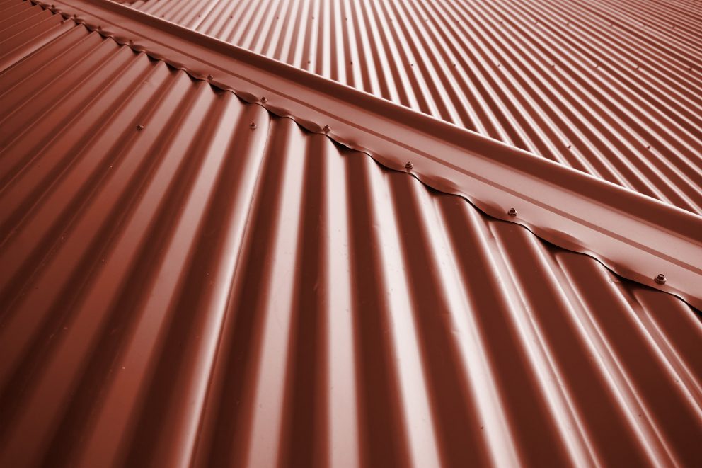 metal building structure attached to pole barn metal