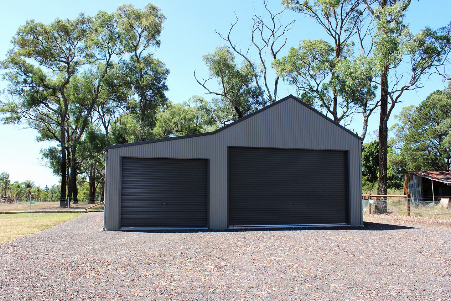 Colourbond shed. Basalt walls, monument doors. Shed 